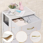 Comodino in tessuto a 4 cassetti, bianco / grigio chiaro / rovere nero / nero