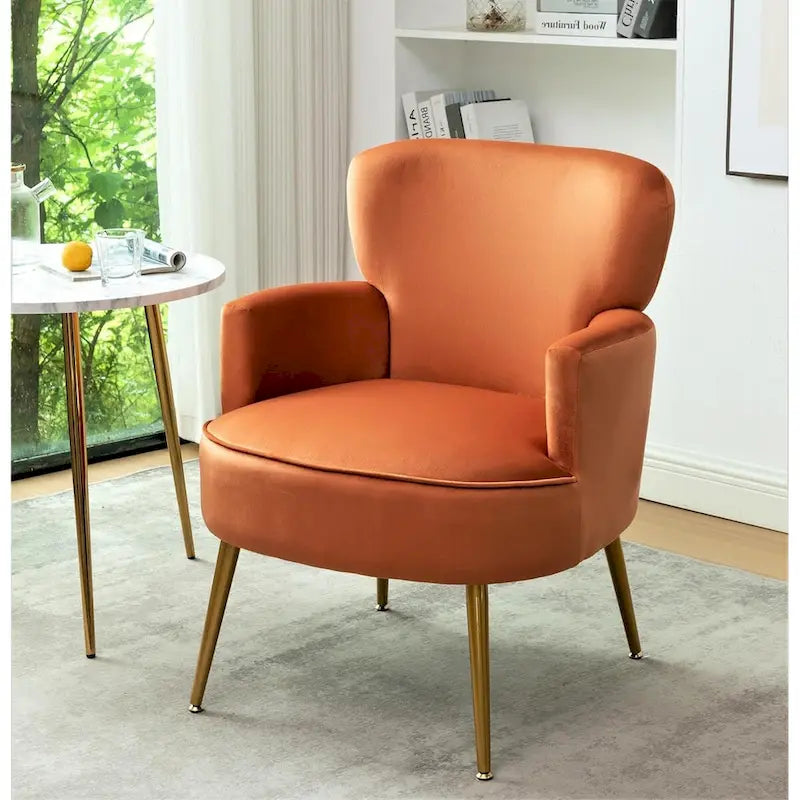 Poltrona con accenti in velluto e gambe in metallo dorato, vari colori, sedile singolo